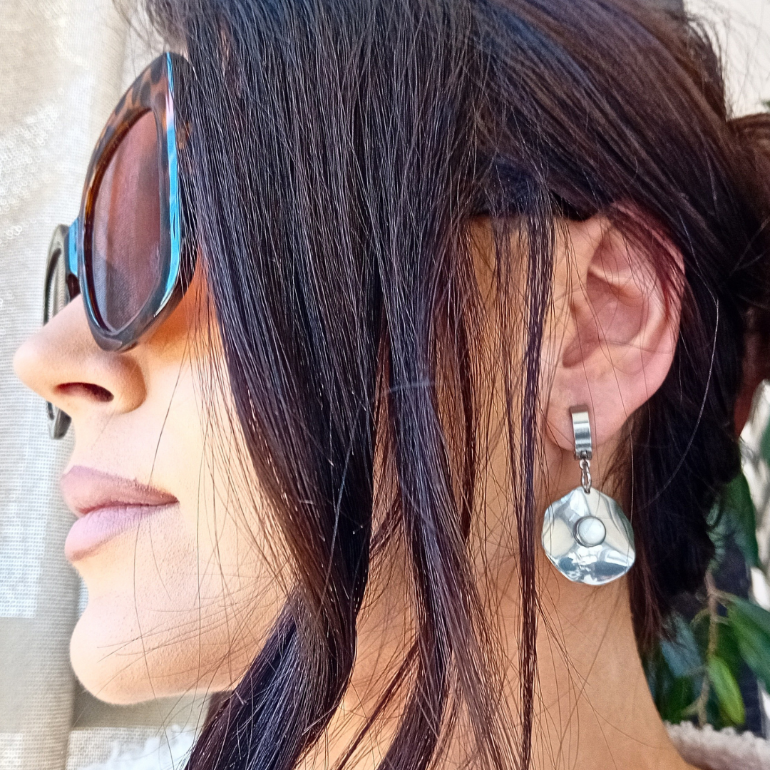 Close-up of Lunë earrings showing luminous mother of pearl detail