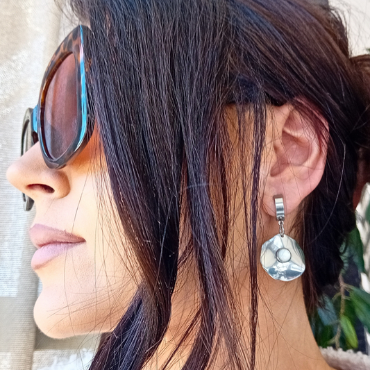 Close-up of Lunë earrings showing luminous mother of pearl detail