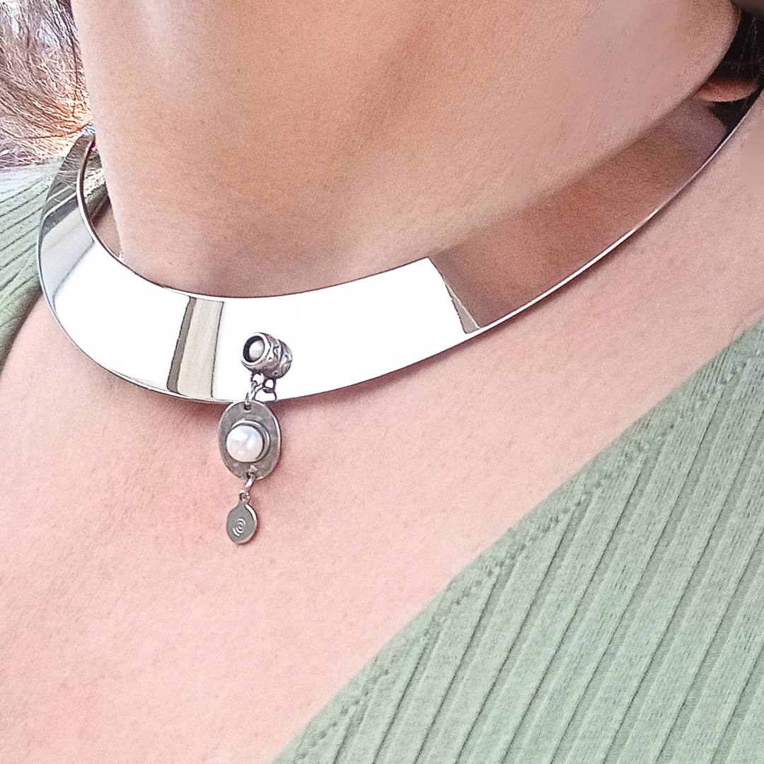 stainless steel choker with pearls worn on neck