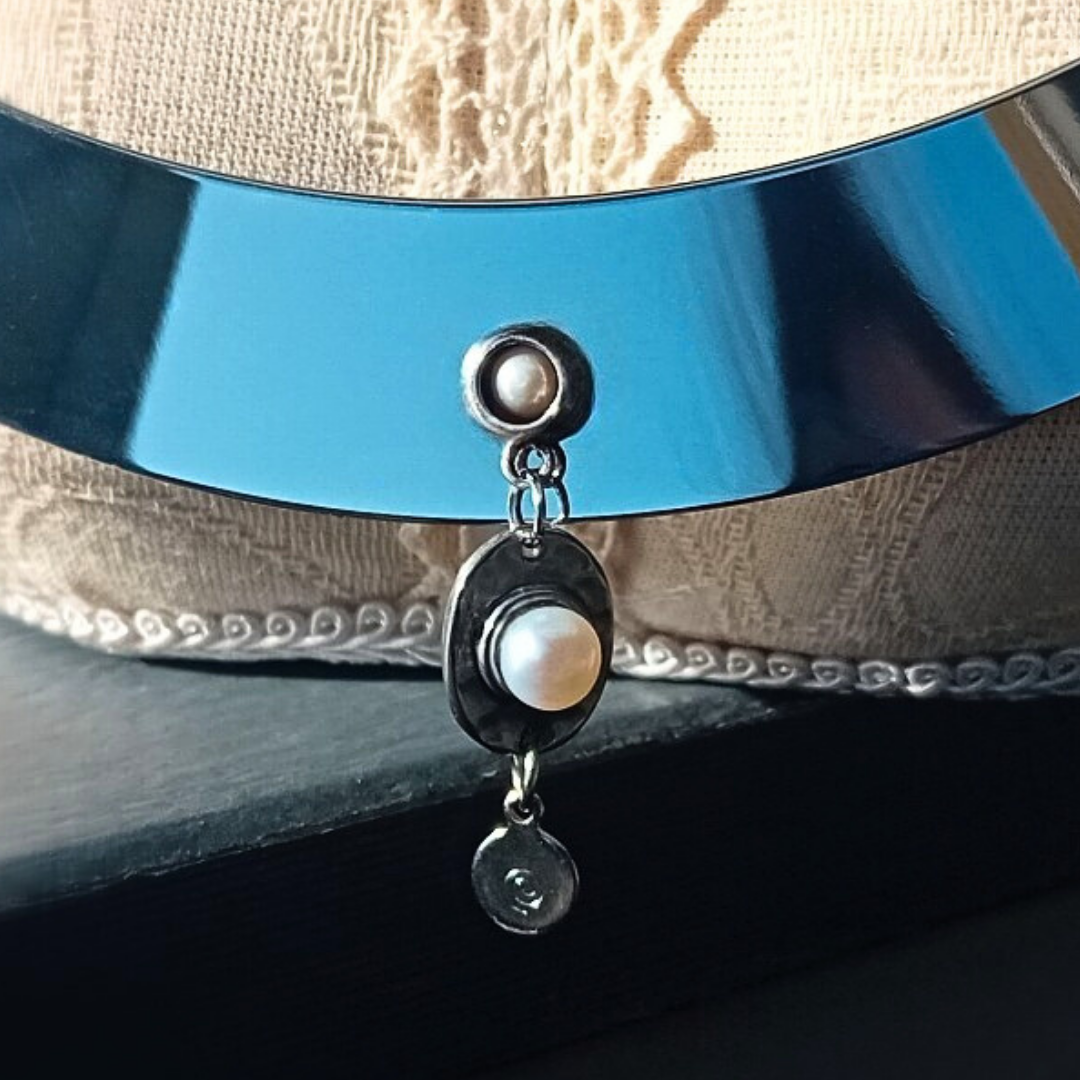 close up of freshwater pearl cabochons on stainless steel choker