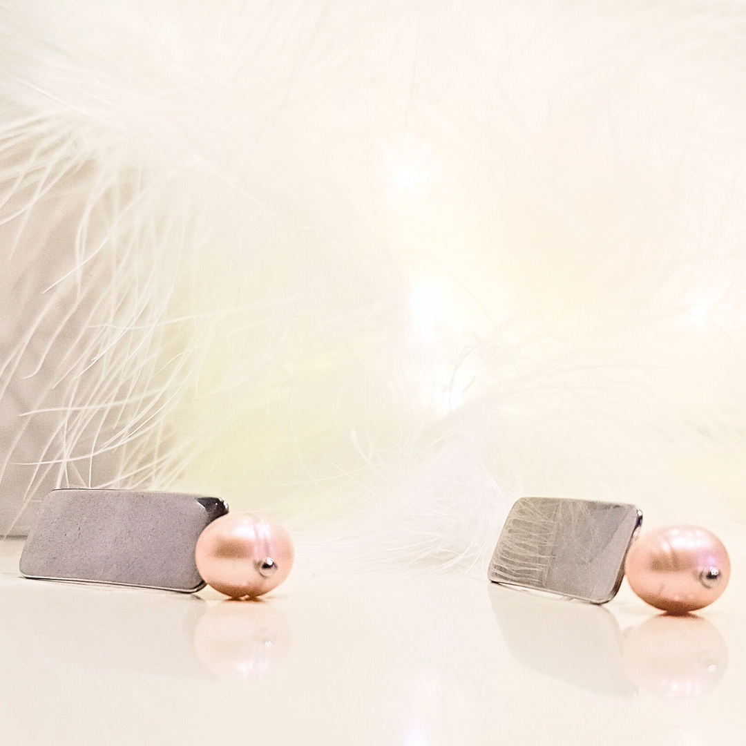 geometric earrings in stainless steel with pearl detail close up