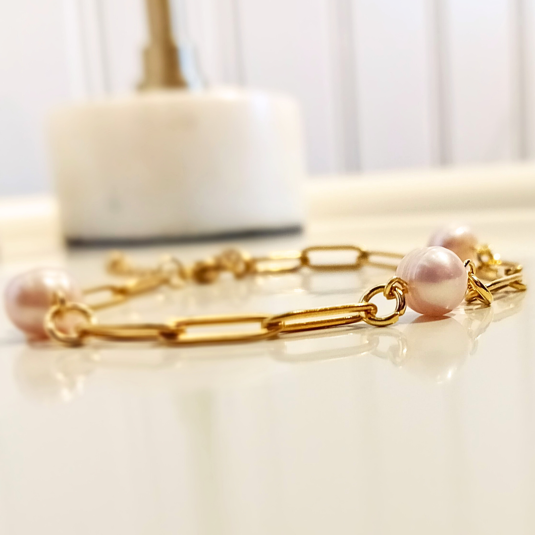 close up of paperclip chain bracelet with freshwater pearl details